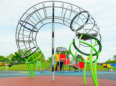 tubular shaped climbing structure in a playground